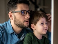 dad and son at computer